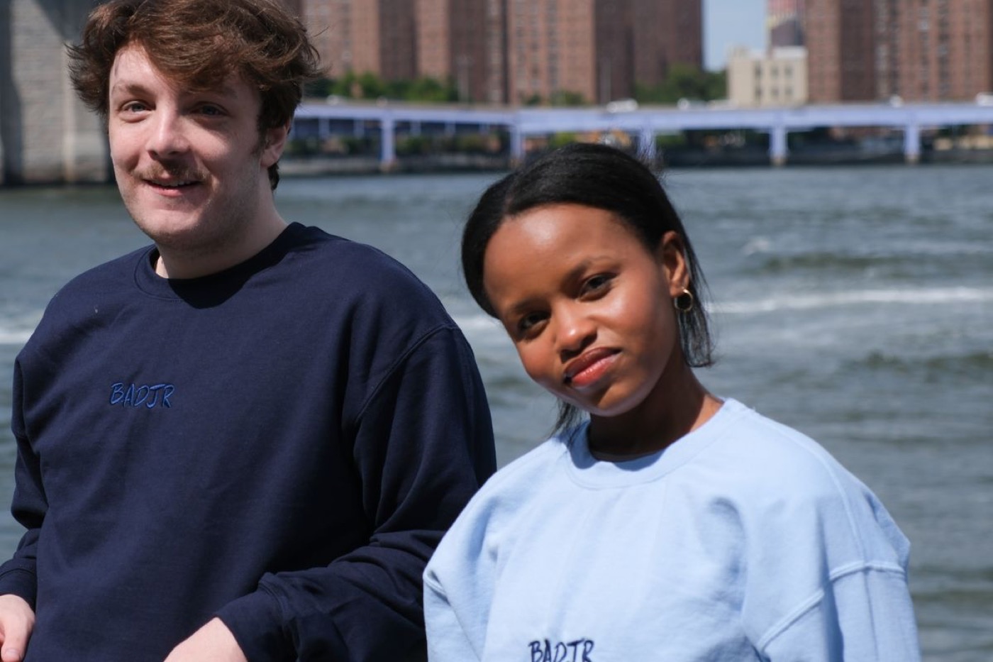 The BaDjR Tech team in BADJR sweatshirts on the East River waterfront